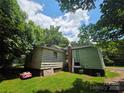 Rear exterior showcasing the home's siding and backyard at 424 Congress S St, York, SC 29745