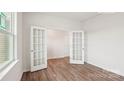 Bright flex room with glass French doors and neutral paint at 5244 Reedy Ridge Rd, Charlotte, NC 28215