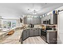 Modern kitchen with granite countertops, stainless steel appliances, and scenic lake views at 860 Jetton St # 59, Davidson, NC 28036