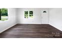 Bright living room featuring natural light, white walls, and modern flooring at 908 Mccollough St, Statesville, NC 28677