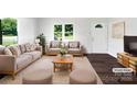 Bright and airy living room featuring neutral decor and a large window at 908 Mccollough St, Statesville, NC 28677