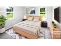 Serene bedroom featuring a comfortable bed, stylish decor, and natural light, virtually staged at 908 Mccollough St, Statesville, NC 28677