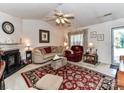 Cozy living room featuring a fireplace and comfortable seating at 9337 Four Mile Creek Rd # 101, Charlotte, NC 28277