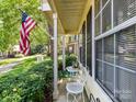 Inviting front porch with seating area, perfect for relaxing outdoors at 9337 Four Mile Creek Rd # 101, Charlotte, NC 28277