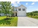 Beautifully maintained two-story home with a two-car garage, and a well-manicured front yard at 10111 Snowbell Ct, Charlotte, NC 28215