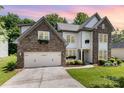 Attractive two-story home with stone facade, two car garage, and inviting curb appeal at 10129 Loch Lomond Dr, Charlotte, NC 28278