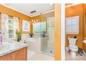 Bright bathroom featuring a glass-enclosed shower and a soaking tub at 10203 Loch Lomond Dr, Charlotte, NC 28278
