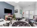 Versatile bonus room with stylish furnishings, including accent furniture, art, and decor at 10203 Loch Lomond Dr, Charlotte, NC 28278