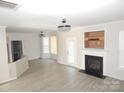 Spacious living room showcasing wood floors and a cozy fireplace at 10615 Elm Bend Dr, Charlotte, NC 28273