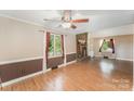 Comfortable living room with a brick fireplace, built-in shelving, and natural light at 110 Hidden Valley St, Cherryville, NC 28021