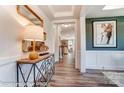 Bright foyer with wood floors, stylish console table, and a view into the open-concept living spaces at 126 Longwood Rd # 52, Mooresville, NC 28115