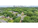 Aerial view of a modern home with city skyline in the background at 129 French St, Charlotte, NC 28216