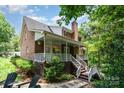 Inviting back porch with white railing and ceiling fan; the perfect spot for relaxing and enjoying the outdoors at 139 Palaside Ne Dr, Concord, NC 28025