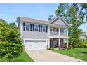 Two-story home boasting gray siding, a front-facing balcony, and a convenient two-car garage at 2439 Judson Dr, Gastonia, NC 28054
