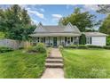Charming home with a covered front porch, walkway and a well-manicured lawn at 300 S Hudson Ave, Spencer, NC 28159