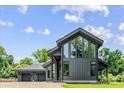 Striking contemporary home design featuring expansive windows and modern architectural details at 3304 Mar Vista Cir, Charlotte, NC 28209