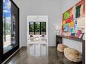 Bright foyer with polished floors, modern decor, and a glimpse into the elegantly furnished sitting area at 3304 Mar Vista Cir, Charlotte, NC 28209