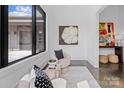 Cozy sitting area featuring comfortable seating, stylish decor, and a view of the outdoors at 3304 Mar Vista Cir, Charlotte, NC 28209