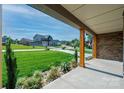 Spacious covered porch with wooden columns offering a view of the neighborhood street at 3741 9Th Street Ne Ct, Hickory, NC 28601