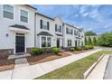 Inviting townhome exterior with covered entry, stone accents and well maintained lawn at 5008 Patton Dr, Gastonia, NC 28056