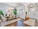 Elegant dining room with hardwood floors, a large wooden table, and plenty of natural light at 501 Preservation Dr, Fort Mill, SC 29715