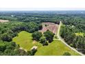 High-angle capture of a land, showcasing a serene combination of verdant greenery and open fields at 5740 Crouse Rd, Crouse, NC 28033