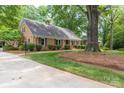 Charming brick home with a well-maintained lawn and driveway at 629 Wingrave Dr, Charlotte, NC 28270