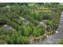 A beautiful aerial view showcasing the approximate lot lines and lake access with dock at 8283 Long Island Rd, Catawba, NC 28609