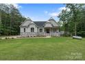 Charming home with a stone facade, manicured lawn, and inviting entrance at 8283 Long Island Rd, Catawba, NC 28609