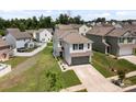 Aerial view of a two-story home with a two-car garage in a residential neighborhood at 1207 Skyflower Way, Charlotte, NC 28214