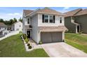 Charming two-story home with a two-car garage, well-maintained landscaping, and beautiful curb appeal at 1207 Skyflower Way, Charlotte, NC 28214