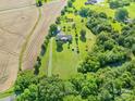 Expansive aerial view of estate featuring lush greenery and farmland at 1909 Mountain Springs Church Rd, Monroe, NC 28112