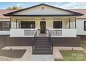 View of covered front porch with stairs and railing at 1909 Mountain Springs Church Rd, Monroe, NC 28112
