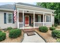 Inviting home featuring a charming brick porch and walkway, complete with a welcoming 'gather' mat at 1912 Dawnhurst Ln, York, SC 29745