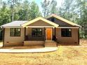 Inviting single-story house featuring a cozy front porch and neutral exterior at 2330 Neill Rd, Lancaster, SC 29720