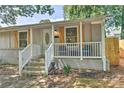 Inviting single-story home featuring a quaint front porch with stylish shutters and an entryway at 3020 Stancill Pl, Charlotte, NC 28205