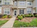 Inviting townhouse exterior showcasing stone accents, tidy landscaping, and a clear pathway at 4607 Silk Tree Ln, Rock Hill, SC 29732
