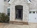 Welcoming front entrance with stone facade and brick steps leading to the front door at 5000 Britannia Blvd, Waxhaw, NC 28173