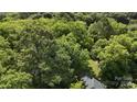 Bird's-eye view of a home nestled among a dense canopy of mature trees at 514 Saluda Rd, Chester, SC 29706