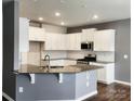 Modern kitchen with stainless steel appliances, granite countertops, and white cabinetry at 5775 Soft Shell Dr # 310, Lancaster, SC 29720