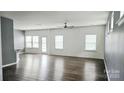 Bright and airy living room with hardwood floors and ample natural light from multiple windows at 5775 Soft Shell Dr # 310, Lancaster, SC 29720