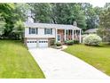 Beautiful home with a two-car garage, a brick facade, a walkway, and a well-kept lawn at 5909 Ryder Ave, Charlotte, NC 28226