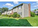 Townhouse complex showcasing tidy landscaping and architectural details at 6044 Heath Valley Rd, Charlotte, NC 28210