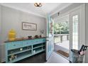 Stylish entryway featuring a unique turquoise console table, tiled floor, and natural light at 926 Meadow Lakes Rd, Rock Hill, SC 29732
