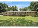 Inviting single-story home with a spacious front yard and a cozy outdoor deck at 926 Meadow Lakes Rd, Rock Hill, SC 29732