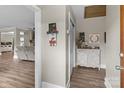 Welcoming hallway with elegant décor, hardwood floors, and a glimpse into the spacious living area at 10637 Highway 52 Hwy, Rockwell, NC 28138