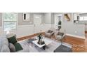 Bright living room with hardwood floors, large windows, and stylish decor at 113 W 5Th Ave, Gastonia, NC 28052