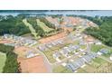 Scenic aerial view of a residential neighborhood near a lake and golf course at 12001 Sam Snead Ct, Lancaster, SC 29720