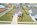 Aerial view of a beautifully designed home with a spacious, well-maintained lawn and fenced yard at 12001 Sam Snead Ct, Lancaster, SC 29720