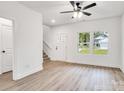 Inviting living area with natural light, wood-look flooring, and staircase access at 1420 Tyler St, Kannapolis, NC 28083